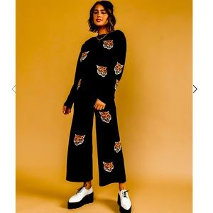 Dressed in  LALA fierce female knit play suit